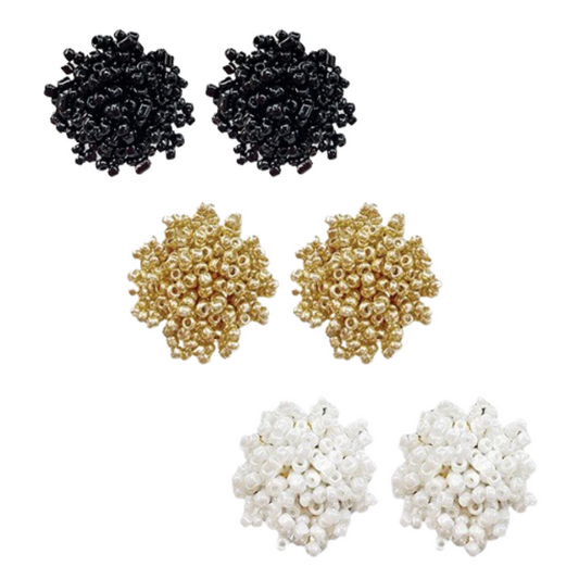 Pom Pom Stud earrings. Available in white, black, and gold