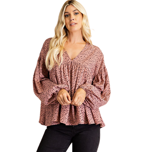This stylish V-Neck Printed Blouse offers a sophisticated look perfect for any occasion. Crafted from a lightweight fabric, the mauve color and long sleeves provide comfort and elegance. Make a statement with this fashionable piece that accentuates the v neck and creates a classic, timeless look.