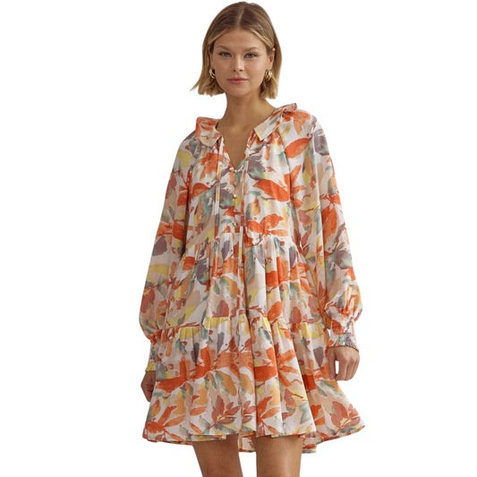 This printed mini dress is perfect for any occasion. With its long sleeves, collared neckline, and smocking at cuffs, it offers a stylish and comfortable fit. The button up detail at the bust adds a touch of elegance, while the lightweight, non-sheer fabric keeps you cool and confident all day.