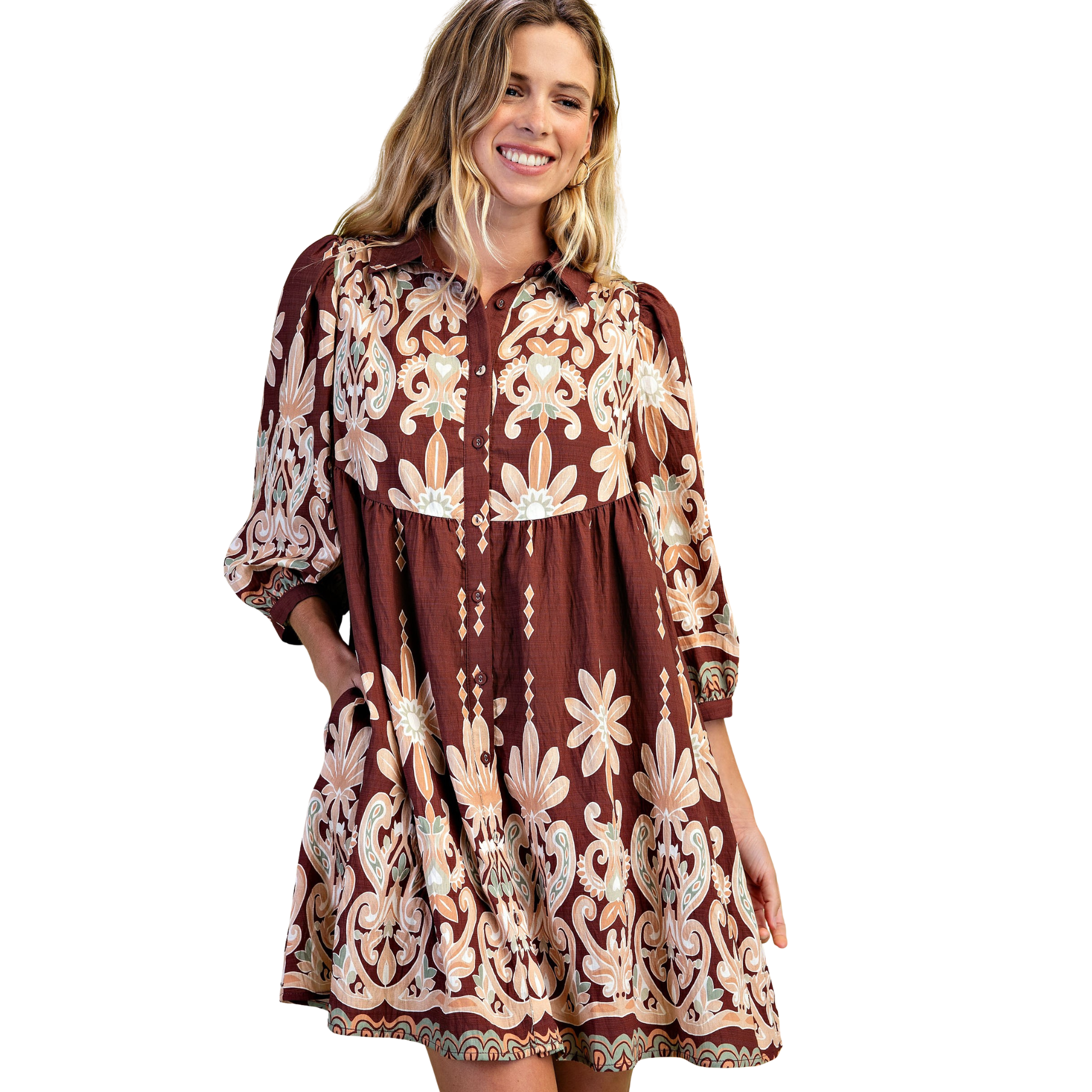 Elevate your everyday style with this charming Printed Shirt Dress by GiGio. Featuring a rich brown mix print, this mini dress combines classic sophistication with modern flair. The three-quarter length sleeves provide the perfect balance of coverage and breathability, making it ideal for transitional seasons. Versatile enough for casual outings or dressed up for special occasions, this piece is a wardrobe essential that works effortlessly from day to night.