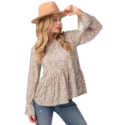 A beautiful piece for casual occasions, this Puff Sleeve Babydoll Top features a striking leaf print in brown and white. Its long sleeves make it perfect for cooler days, while its breezy fit is perfect for any occasion.
