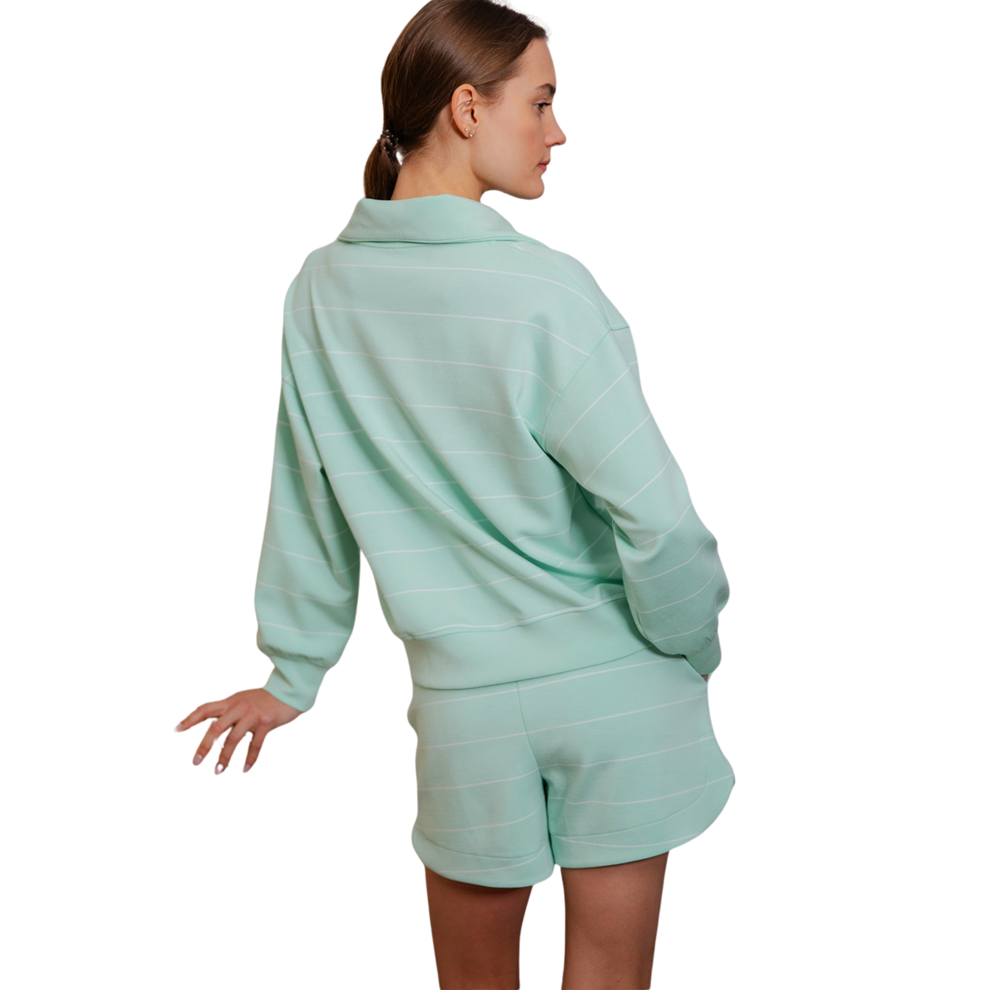 Your wardrobe needs this Modal Scuba Pullover and Skort Set by Rae Mode. The soft, breathable modal fabric offers comfort for all-day wear, while the half-zip design provides easy layering and temperature control. Featuring a fresh mint and cream striped pattern, this coordinated set pairs a relaxed pullover with a flattering skort for effortless style. Perfect for weekend outings, active days, or cozy lounging. The versatile color palette works seamlessly with your existing pieces.