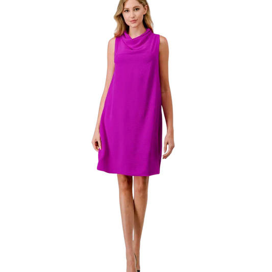 Expertly crafted with a draped neck, this purple mini dress is both stylish and lightweight. Its sleeveless design allows for maximum comfort and flexibility, perfect for any occasion. Add a touch of elegance to your wardrobe with this versatile and trendy dress.
