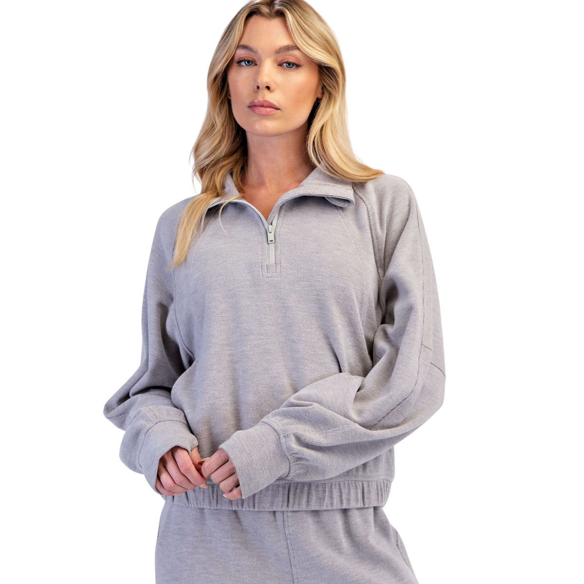 The Rib Brushed Quarter Zip Pullover from Rae Mode combines effortless style with everyday comfort. Crafted in a sophisticated heather grey, this collared pullover features a convenient quarter zip design for easy layering and temperature control. The textured rib fabric adds subtle dimension while maintaining a polished, versatile look that pairs seamlessly with jeans, joggers, or casual trousers. Perfect for transitions between seasons or relaxed outings.