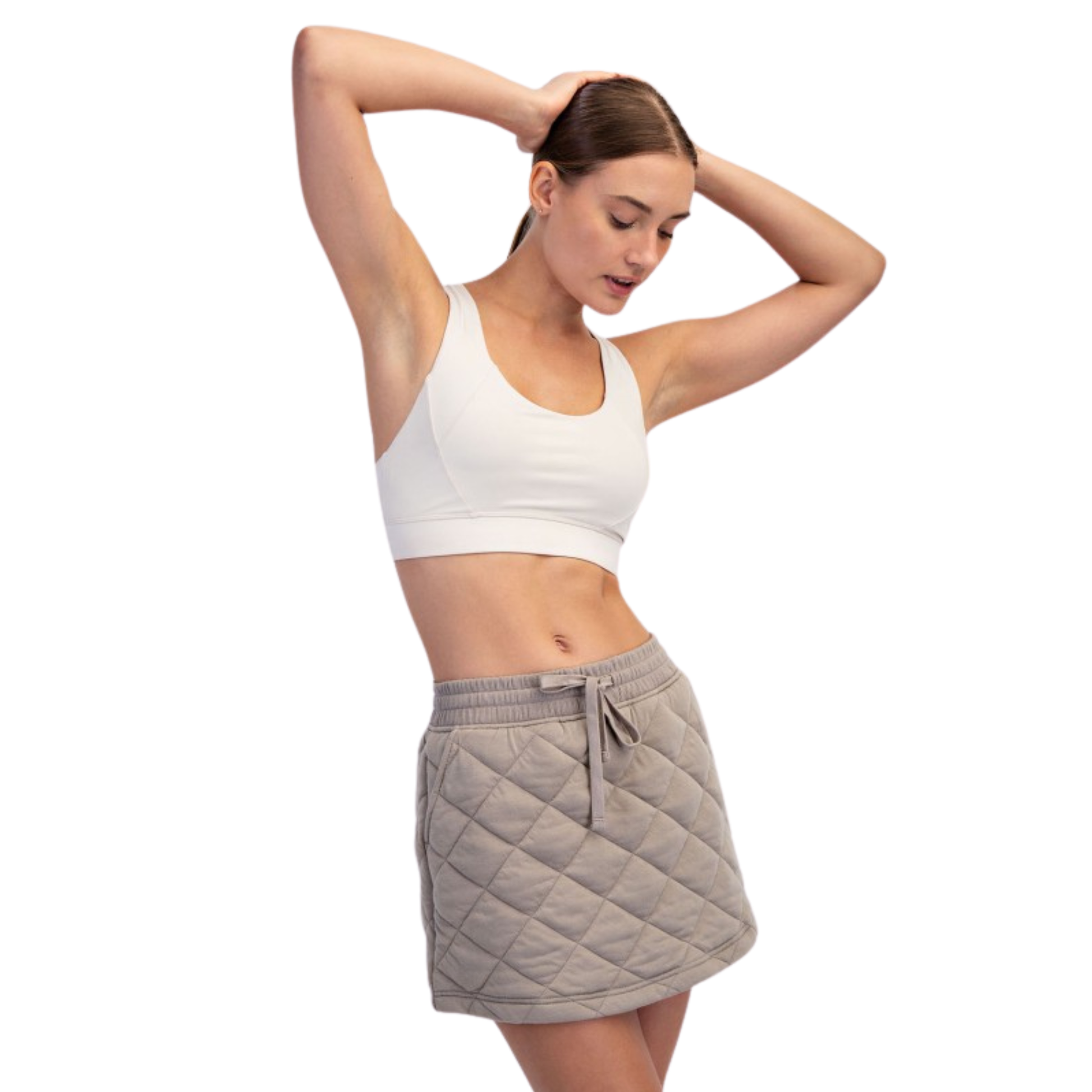 This Rae Mode mini skirt features a sophisticated taupe color and a distinctive quilted design, combining style with subtle texture. Its tailored fit accentuates your silhouette while offering versatile wear, suitable for both casual and dressier occasions. Crafted to blend comfort with a modern aesthetic, this skirt is a refined choice for a polished wardrobe update.