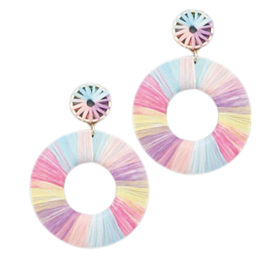 Add a cheerful touch to any outfit with these lightweight Raffia Wrapped Hoops. The dangle earrings feature a pastel rainbow of colors that will instantly brighten up any look. Perfect for any occasion.