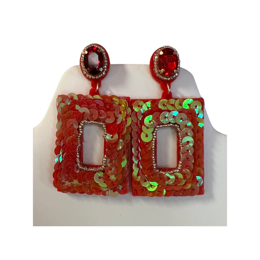 These chic rectangle sequin earrings come in two vibrant colors. Crafted with durable sequins for long-lasting shine and quality, the lightweight earrings feature a dangle design for an elegant look. Add a touch of glamour to any outfit with these eye-catching earrings.