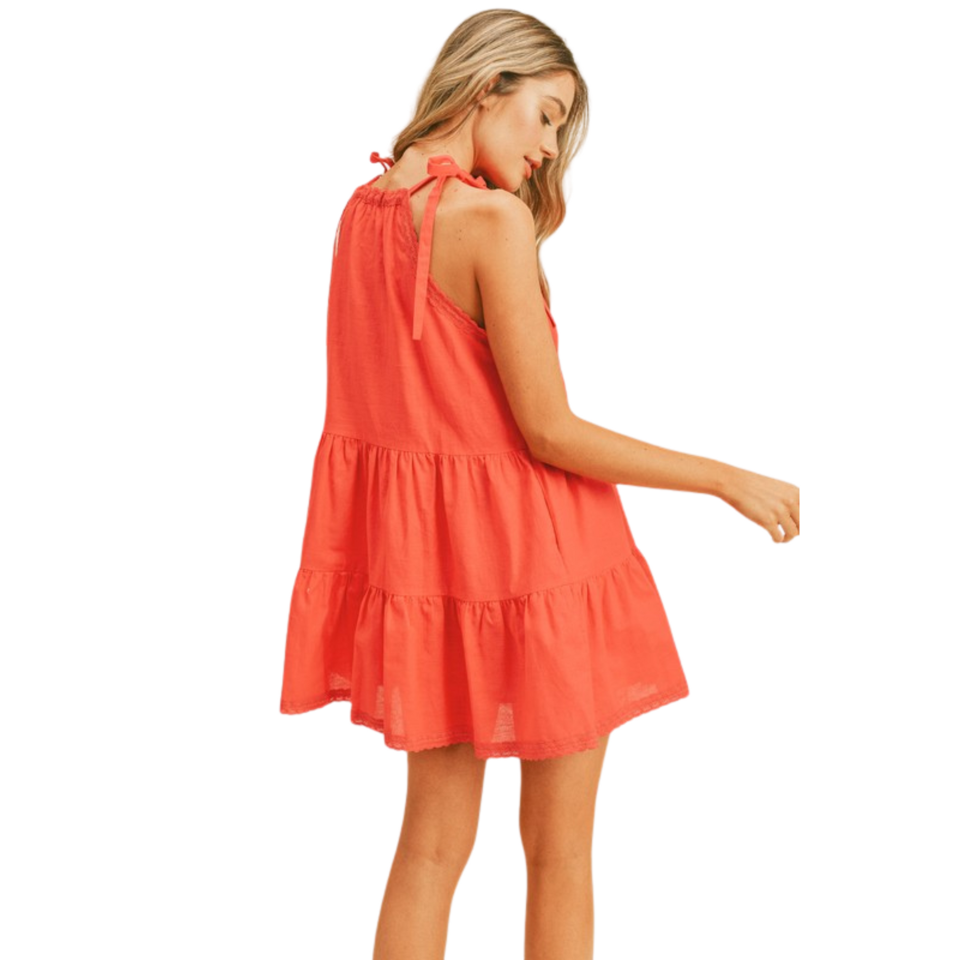 Experience ultimate comfort and style with our Halter Babydoll Dress. This mini dress features a flattering halter neckline with delicate lace trim and adjustable straps for a perfect fit. The tiered seams and pockets add a touch of convenience while the bright red color makes a bold statement. Stay cool and chic with its lined design.