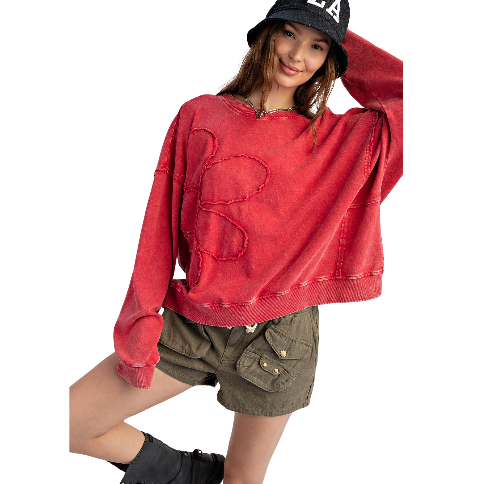 Introducing our Flower Patch Pullover, the perfect addition to your wardrobe. Made of soft, mineral washed terry knit, this boho red pullover features a relaxed fit, dropped shoulders, and raw cut seams. The unique flower patch detailing on the front adds a touch of charm. Stay cozy and stylish with this must-have piece.