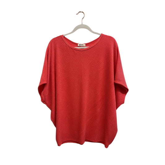 Expertly crafted from soft, ribbed fabric, this Oversized Ribbed Batwing Top in red is the perfect blend of comfort and style. With its loose, draping fit, it offers a relaxed and effortless look, perfect for any occasion. Elevate your wardrobe with this must-have top.