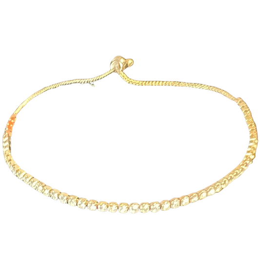 This dainty gold Retractable Rhinestone Bracelet features an adjustable band lined with small rhinestones. The perfect piece of jewelry for adding a touch of sparkle to any look.