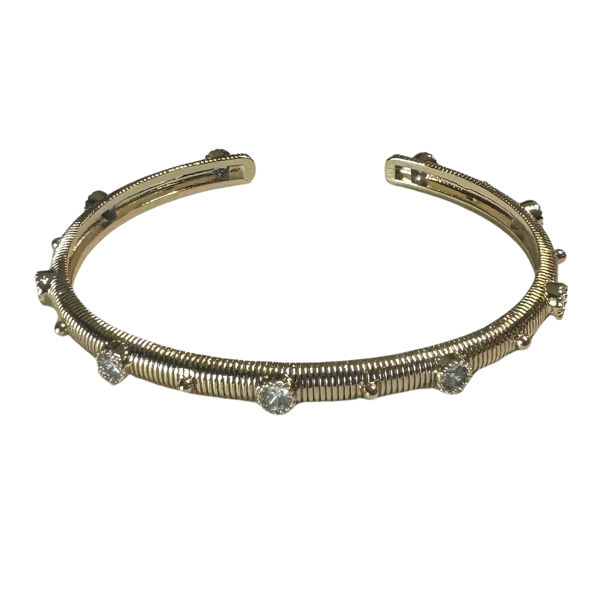 This elegant Rhinestone Cuff Bangle features gold plating and shimmering rhinestone accents. The open cuff design makes it easy to slip on and off, while adding a touch of sophistication to any outfit. Perfect for special occasions or everyday wear, this bangle is a must-have for any jewelry collection.