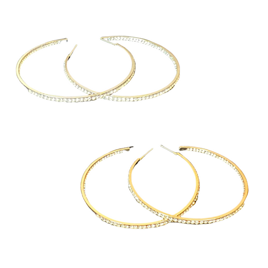 Look glamorous with these Thin Rhinestone Hoop Earrings. Crafted from a thin metal frame and lined with rhinestones, these large hoops come in either a sparkling silver or golden hue. Shine and shimmer with these earrings that are sure to turn heads.