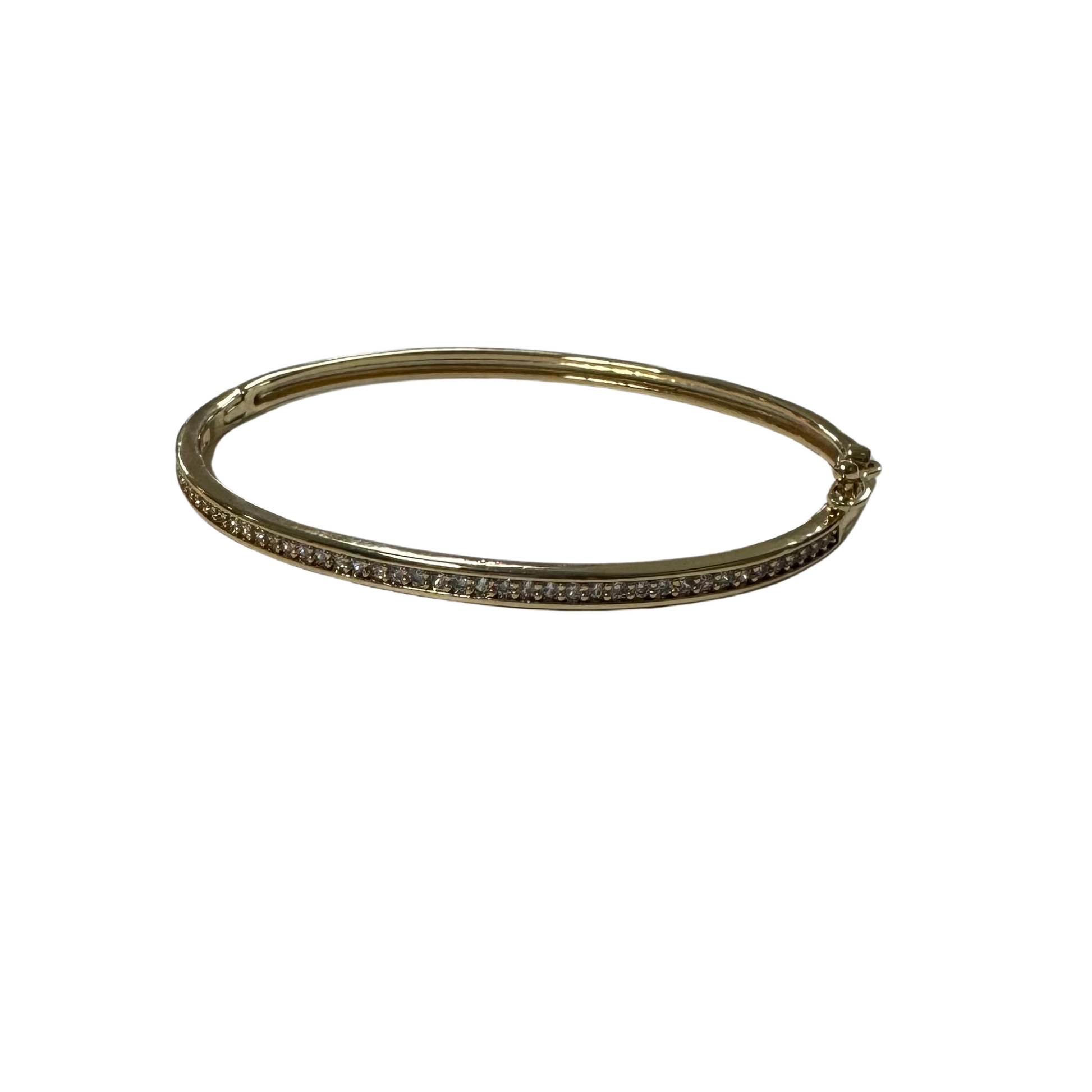 This Thin Rhinestone Lined Bangle features a delicate gold design accented with tiny rhinestones for an elegant touch. With a secure clasp closure, this bangle bracelet is the perfect accessory for any outfit. Its sophisticated style adds a touch of glamour to any look.