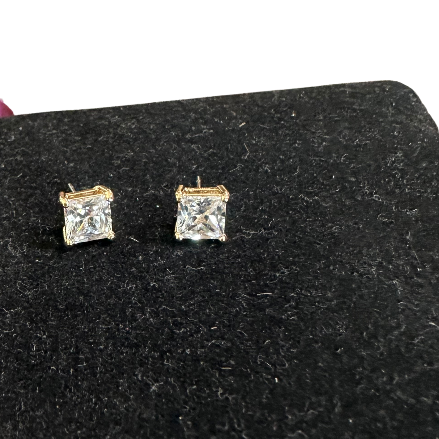 Elevate your everyday look with these stunning Square Rhinestone Studs from Perdido Gems. Crafted in lustrous gold, these petite studs feature sparkling rhinestones set in a classic square shape for a touch of glamour that works with any style. Perfect for layering, stacking, or wearing solo, they're the ideal accessory for adding subtle sparkle to your ears. Lightweight and comfortable for all-day wear.
