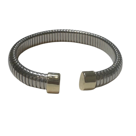 This open-ended cuff bangle features a sophisticated blend of silver and gold tones, creating a versatile accessory that complements any outfit. Its ribbed design adds texture and depth, enhancing its modern elegance. The adjustable open-ended style ensures a comfortable fit for various wrist sizes, making it a refined choice for both everyday wear and special occasions.