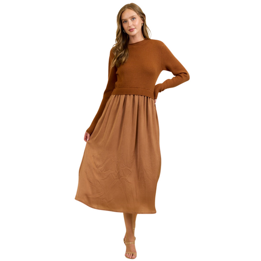 This ribbed knit maxi dress in a rich mocha shade from Doe and Rae combines comfort with sophistication. The soft, stretchy fabric contours gently to the body, offering a flattering fit while ensuring ease of movement. Its sweater top design adds warmth and versatility, making it ideal for both casual and dressier occasions. Perfect for layering or wearing alone, this dress is a refined choice for those seeking effortless style in cooler seasons.