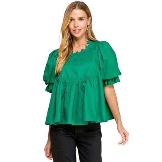 Expertly crafted with swing-style design and intricate ricrac detailing, this top is both stylish and comfortable. The unique bubble sleeves add a touch of whimsy while the back keyhole opening completes the look. The perfect addition to your wardrobe, this top is a must-have for any fashion-forward individual.