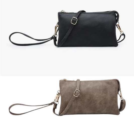The Riley bag is one of our top sellers! This crossbody/clutch has two major compartments with one middle zipper pocket and a top zipper closure. Inside are two slip pockets and six cardholders. Wear it as a crossbody or use it as a clutch! Includes a detachable wristlet strap and an adjustable shoulder strap. Made of vegan leather. Available in Midnight Black and Chocolate.