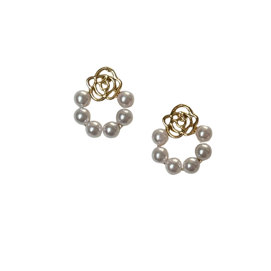Add a touch of elegance to your look with our Rose and Pearl Earrings. Crafted with stunning gold studs, these earrings feature a delicate pearl wreath and a beautiful gold rose accent. Perfect for any occasion, these earrings will elevate your style with a hint of sophistication.