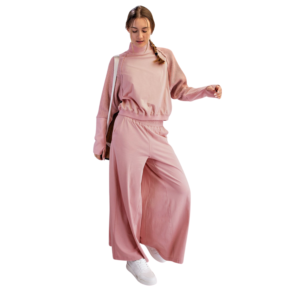 Elevate your everyday style with this sophisticated rose-colored two-piece set from Rae Mode. The long textured sleeves add visual interest and dimension to the top, creating a refined silhouette perfect for casual outings or relaxed weekends. Paired with matching bottoms, this coordinated ensemble offers effortless styling with a modern, polished look.