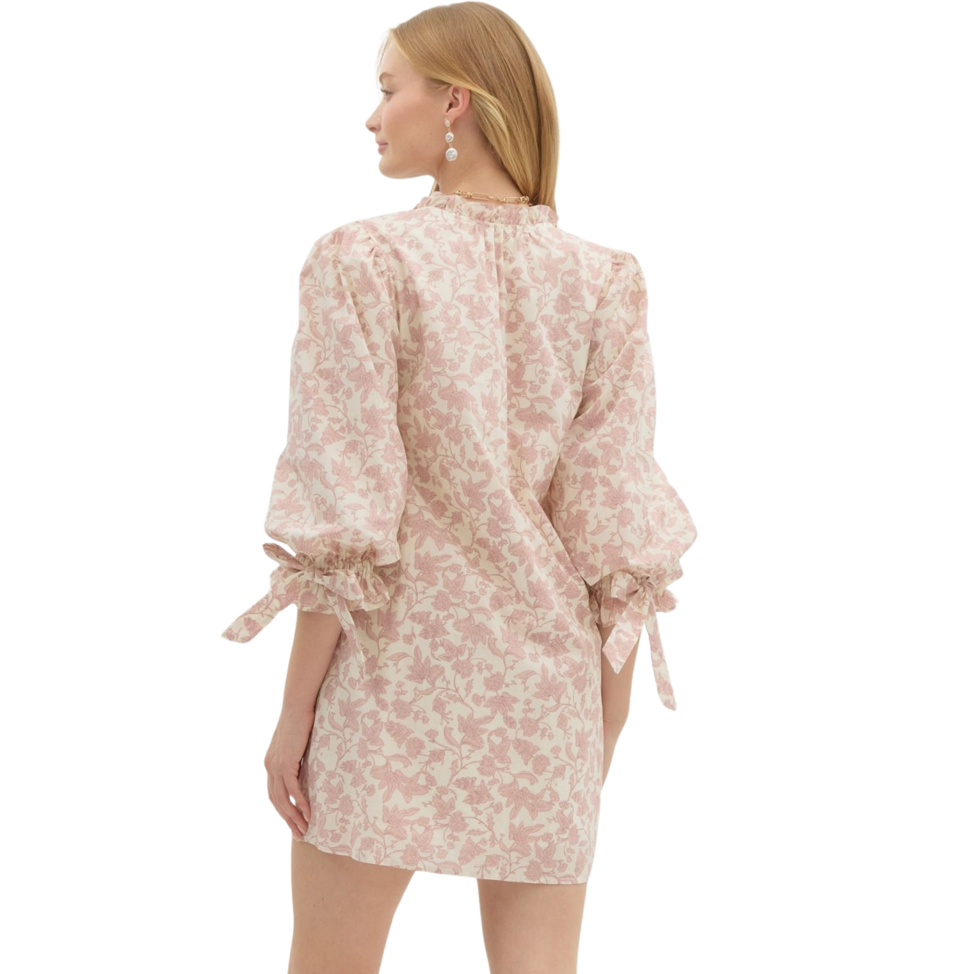 Introducing our Floral Print Pullover Mini Dress with ¾ puff sleeves and fixed ribbon detailing. Stay stylish and functional with side pockets, inner lining, and non-sheer, lightweight fabric. In a lovely rose color, this dress is perfect for any occasion.