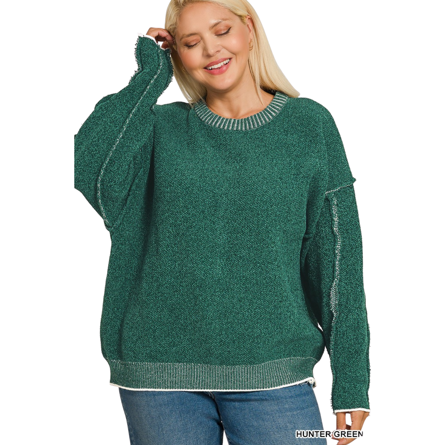 This Zenana round neck sweater combines understated elegance with contemporary design. Crafted in a sophisticated hunter green, it offers versatile styling for any season. The exposed seams add an intentional design detail that elevates the piece beyond basic basics, creating visual interest and a modern aesthetic. Perfect for layering or wearing solo, this sweater delivers quality construction and timeless appeal for the discerning wardrobe.