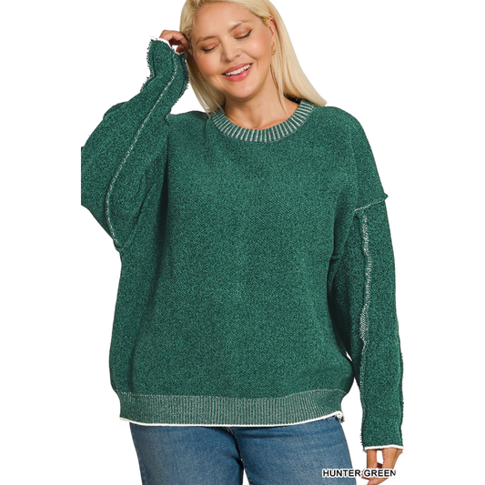 This Zenana round neck sweater combines understated elegance with contemporary design. Crafted in a sophisticated hunter green, it offers versatile styling for any season. The exposed seams add an intentional design detail that elevates the piece beyond basic basics, creating visual interest and a modern aesthetic. Perfect for layering or wearing solo, this sweater delivers quality construction and timeless appeal for the discerning wardrobe.