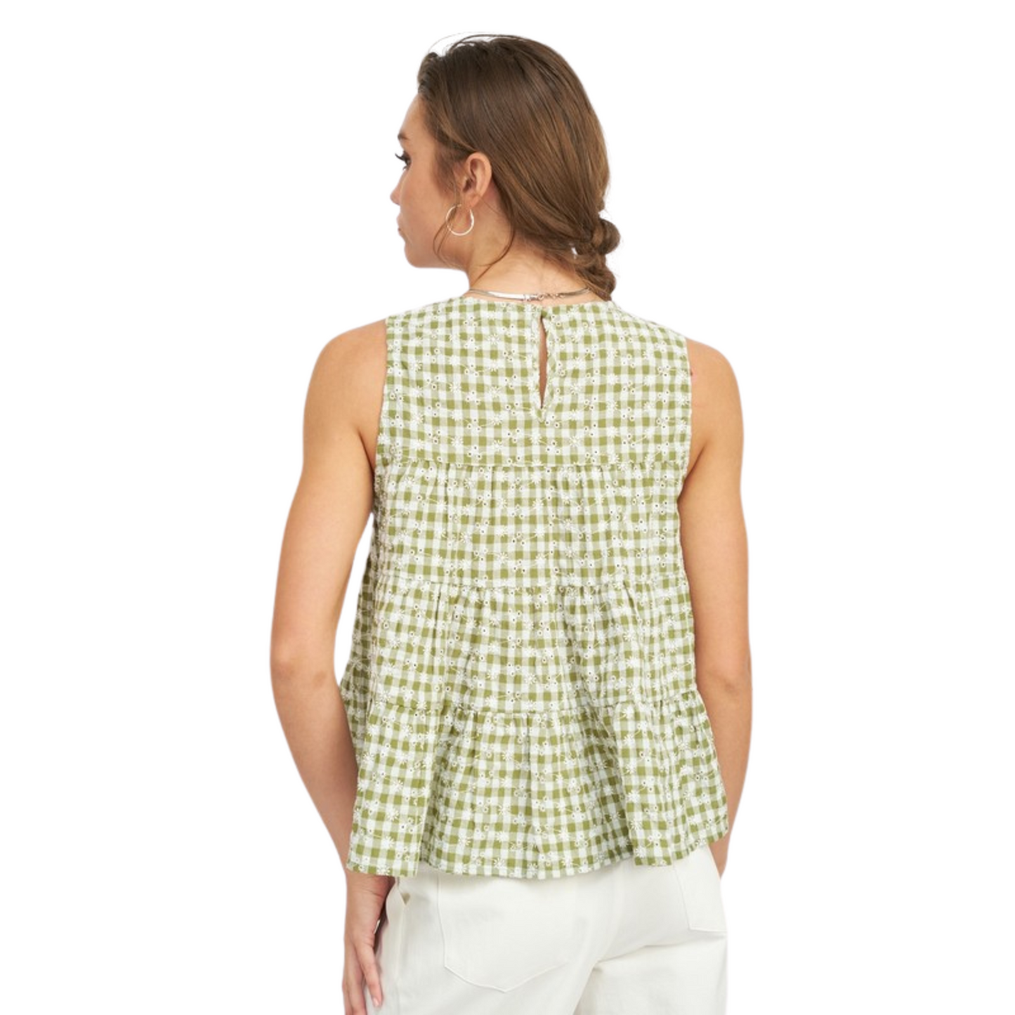 This Ruffled Sleeveless Top is made with lightweight fabric featuring a classic gingham pattern in green and white. Its sleeveless design and beautiful ruffles make it ideal for warm summer days.