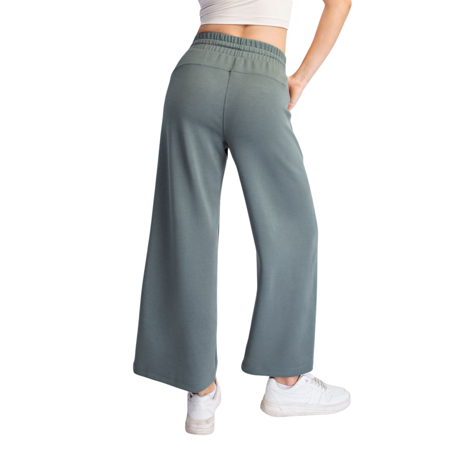 Elevate your casual wardrobe with these Modal Scuba Wide Leg Pants from Rae Mode. Crafted in a soft, breathable modal fabric, these cropped trousers feature a comfortable elastic waistband and adjustable drawstring for a customizable fit. The wide-leg silhouette offers a relaxed, flattering cut perfect for everyday wear. Available in a sophisticated sage green shade that pairs effortlessly with any outfit. Ideal for lounging, running errands, or dressing down your favorite tops.