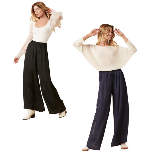 These flattering and comfortable Satin Wide Leg Pants feature a lightweight satin woven fabric and an elastic waistband for easy adjustment. The wide leg and side pockets provide a timeless look that is perfect for any occasion. Available in black or navy.