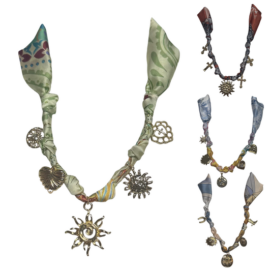 Discover the elegance of Golden Stella’s Scarf Necklace with Charms, expertly crafted to elevate your style. Choose from a variety of designs featuring short scarves adorned with delicate gold charms, perfect for adding a refined touch to any outfit. This versatile accessory combines the softness of fabric with the subtle shine of gold, offering a sophisticated statement piece for discerning fashion enthusiasts.