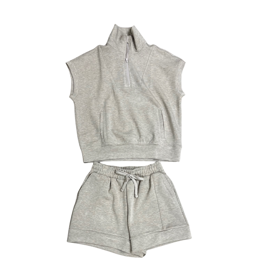 Elevate your casual wardrobe with this Modal Scuba Top and Shorts Set from Rae Mode. The heather taupe colorway offers a versatile, neutral tone that pairs effortlessly with your everyday essentials. The short sleeve top features a comfortable, relaxed fit perfect for lounging or running errands. Coordinating drawstring shorts provide an adjustable fit and convenient pockets for practicality. The soft modal fabric blend delivers a smooth, breathable feel against your skin. This matching set makes getting dr