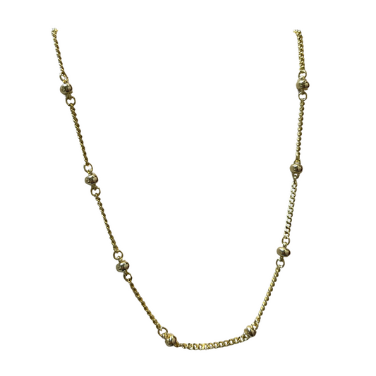 This elegant necklace features a coil design made of gold, with a unique ball accent. The shorter length makes it perfect for layering or as a statement piece on its own. Elevate any outfit with this versatile and stylish accessory.