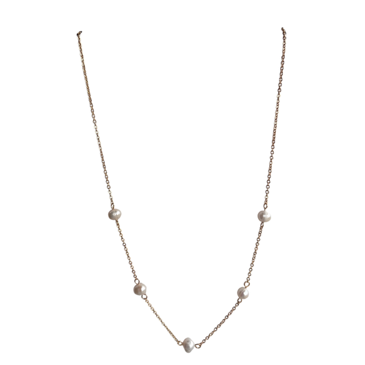 Elevate your everyday elegance with this stunning short pearl necklace from Perdido Gems. Delicate pearls are beautifully complemented by lustrous gold accents, creating a timeless piece that transitions seamlessly from day to night. The shorter length sits perfectly at the collarbone, offering a refined silhouette that flatters any neckline. Crafted with attention to detail, this necklace is an essential addition to any jewelry collection.