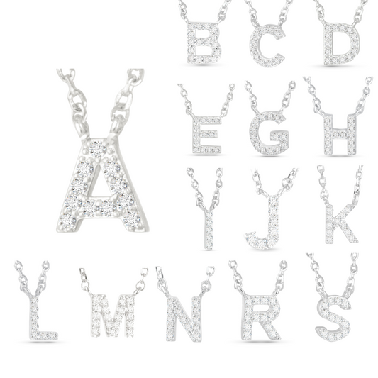 Expertly crafted with silver and adorned with sparkling rhinestone accents, this Cubic Zirconia Initial Necklace offers a variety of letters to choose from. Add a touch of elegance and personalization to any outfit with this timeless piece.