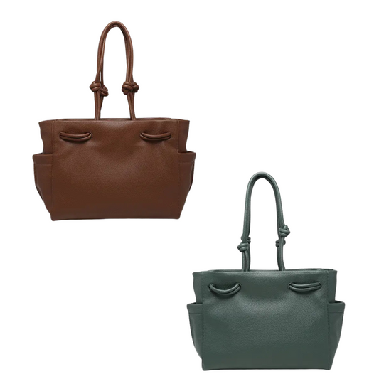 The Skyler Knotted Handle Tote by Jen &amp; Co. offers a medium-sized design perfect for everyday use. Available in sophisticated brown or dark teal, this purse features a distinctive knotted handle that combines style with comfort. Its versatile size and elegant details make it an excellent choice for those seeking both functionality and refined aesthetics.