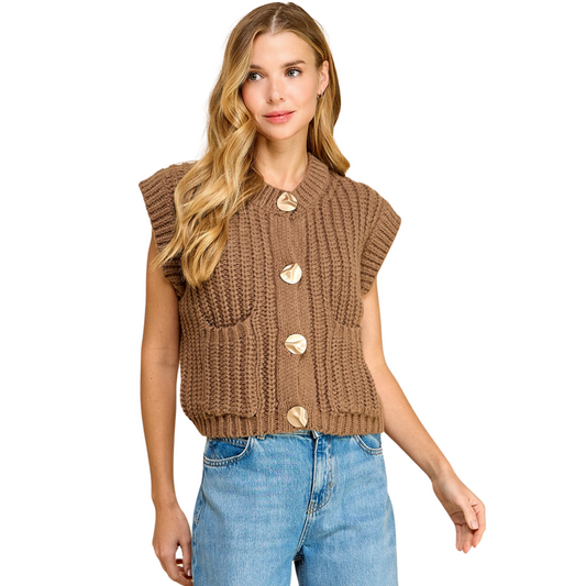 This TCEC brand Sleeveless Knit Sweater Vest comes in a fashionable brown color with an oversized fit. The sleeveless design is perfect for layering and the knit material adds both warmth and style. Stay on-trend with this versatile and comfortable piece.