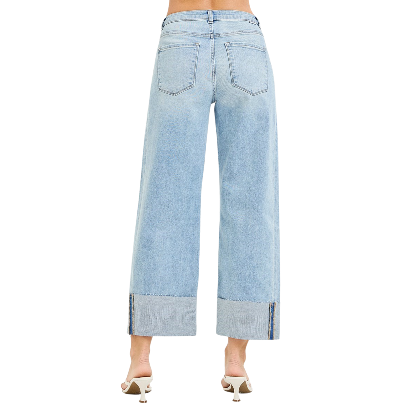 Slouchy Barrel Jeans in a light wash with a distinctive double waistband detail that adds modern edge to a relaxed silhouette. The cropped length hits at the ankle for a contemporary fit that pairs effortlessly with sneakers or heels. Crafted by Risen, these jeans deliver quality construction and on-trend styling for everyday wear.
