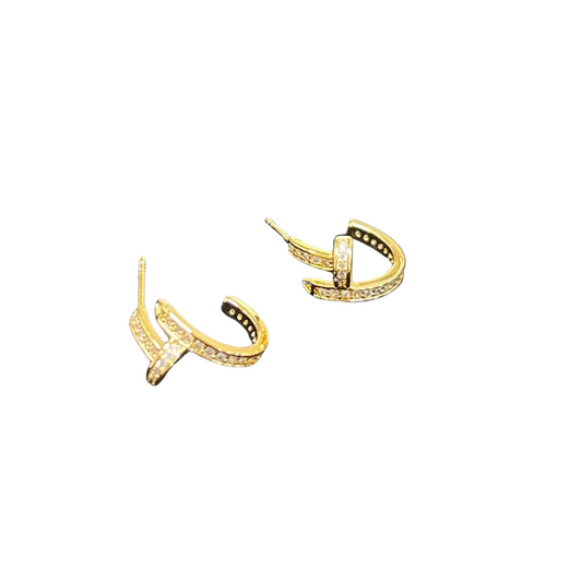 These Small Rhinestone Hoops add just the right amount of sparkle to your outfit. The delicate hoop design is complemented by stunning rhinestone accents that catch the light and elevate your look. Perfect for any occasion, these earrings will add a touch of glamour to your style.