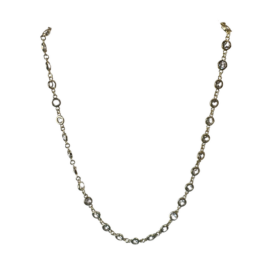 As an industry expert, this Small Rhinestone Necklace adds glamour with its delicate gold chain and rhinestone accent that will elevate any outfit. Its short length also ensures a comfortable fit. A must-have accessory for elegant occasions.