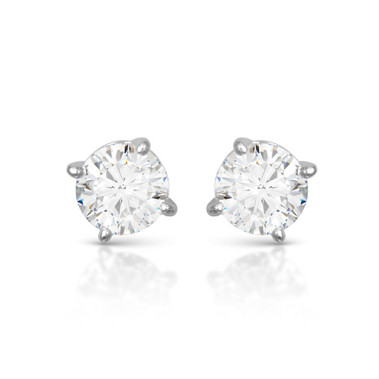 Elevate any outfit with our stunning .75 karat stud earrings. Made with high quality silver and sparkling rhinestones, these elegant cubic zirconia earrings are a perfect addition to your jewelry collection. Enhance your style with these classic stud earrings.
