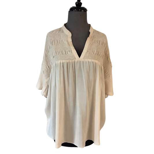 This Smocked Band Collar Shirt is the perfect combination of eye-catching style and comfort. Crafted with a classic cream color and a V-neck, this shirt features flutter sleeve design and sheer fabric for a timeless look. Perfect for any occasion.