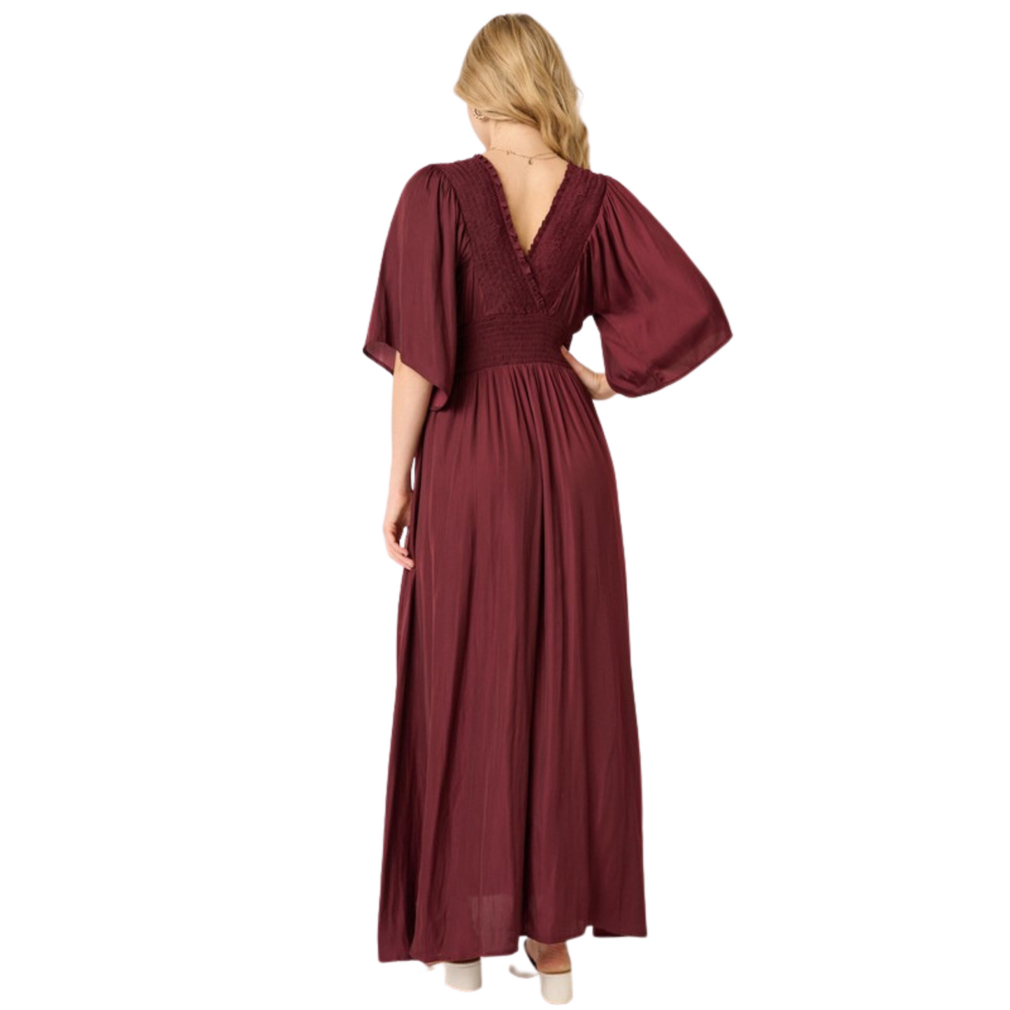 The Smock Detail Maxi Dress is made with luxurious satin woven fabric for a smooth and sophisticated look. Featuring smocking detail on the front and back, a surplice front, ruffle short sleeve and smocking detail waistband, this dress ensures a comfortable and flattering fit. Finished with a maxi length silhouette, this beautiful wine-colored dress is perfect for any special occasion.