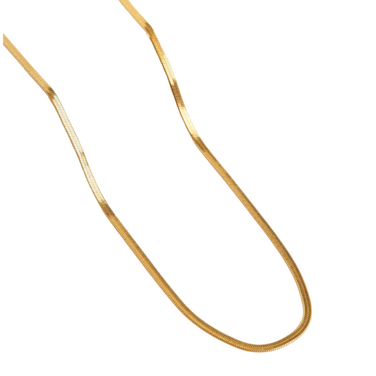 Crafted in 18-karat gold, this 18" snake chain necklace combines timeless elegance with durability. Its smooth, flexible design ensures a comfortable fit that contours naturally around the neck. Waterproof and resistant to tarnish, it maintains its radiant shine in any environment, making it ideal for everyday wear or special occasions. This necklace offers a sophisticated accessory that balances luxury with practicality.