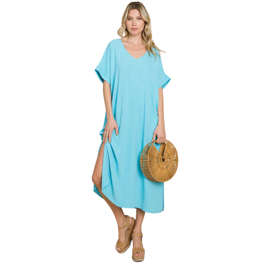 This aqua blue maxi dress features short sleeves, pockets, and lightweight fabric. It provides comfort and convenience, allowing you to carry all of your belongings with you while still feeling light and stylish.