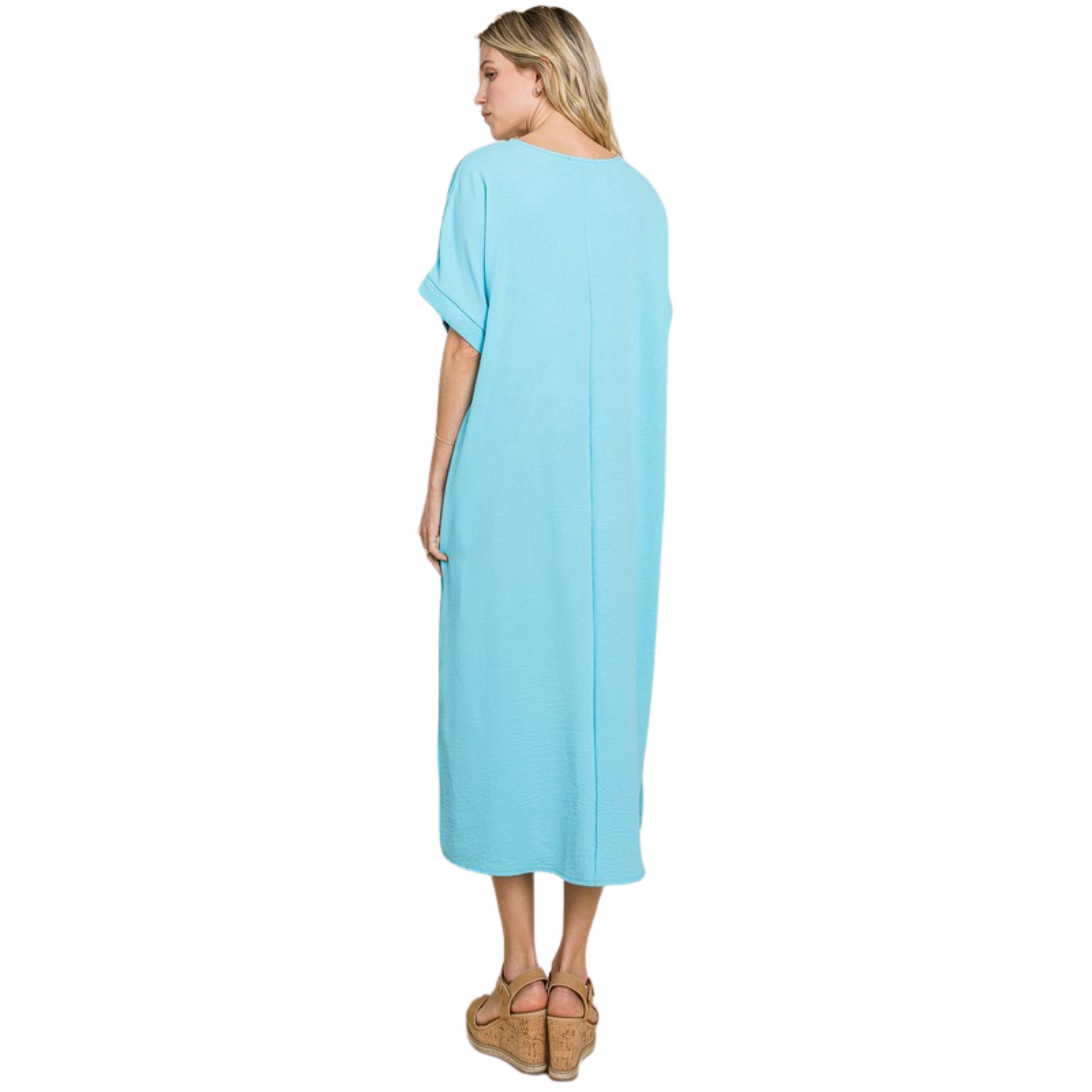 This aqua blue maxi dress features short sleeves, pockets, and lightweight fabric. It provides comfort and convenience, allowing you to carry all of your belongings with you while still feeling light and stylish.