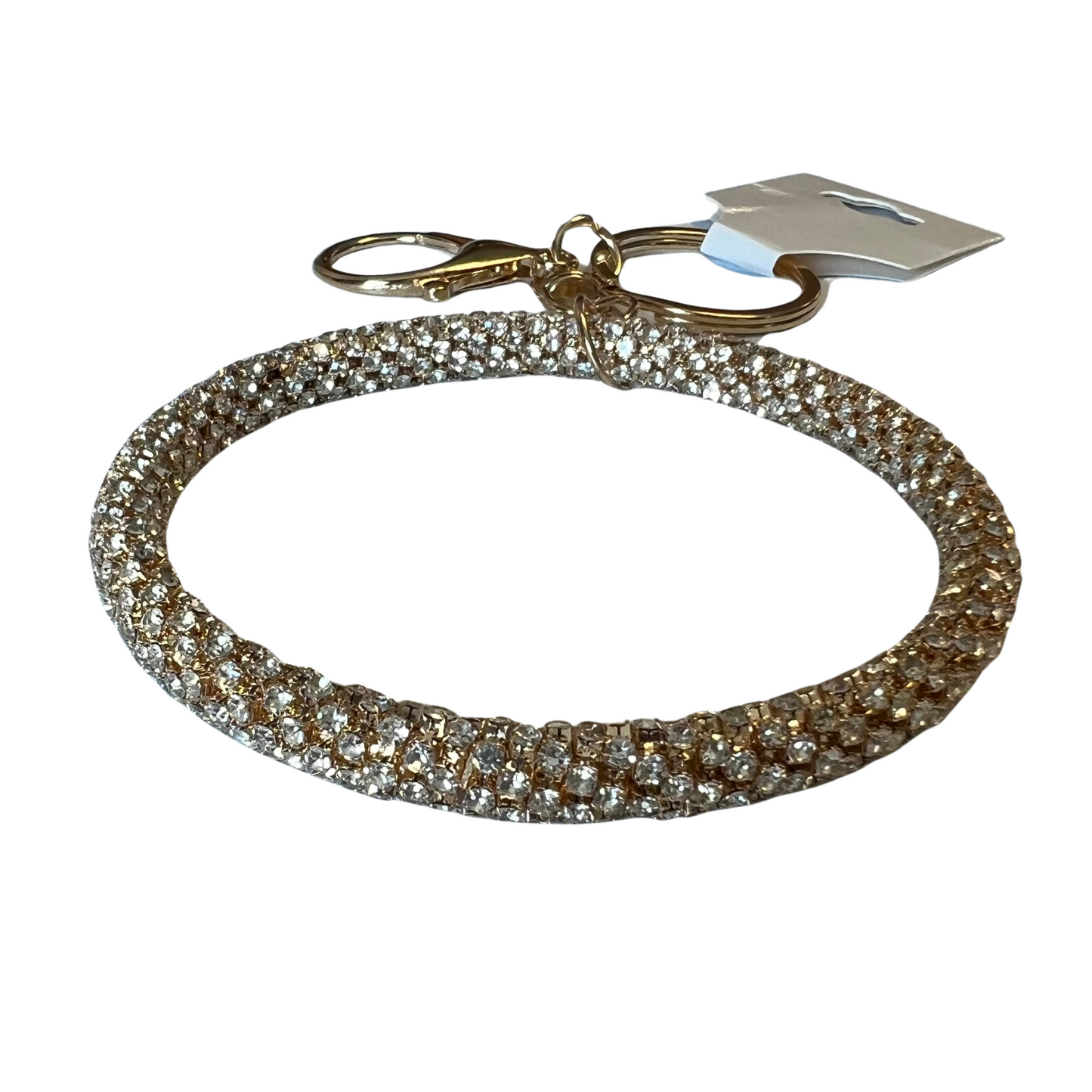 The Sparkle Bangle Keychain is a fashionable accessory to any set of keys. Crafted from durable materials, it comes in two colors including silver and gold, both decorated with sparkling rhinestones for added glamour. Carry your keys in style with this stunning keychain.