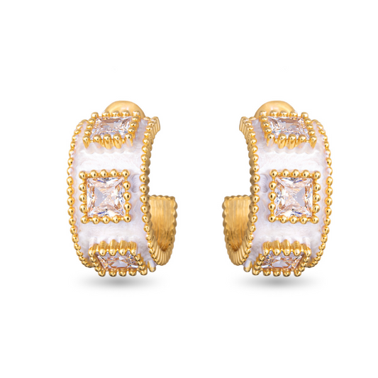 Expertly crafted by Amanda Blu, these Square Cut CZ Huggie Hoops are the perfect addition to any jewelry collection. The small hoops are accented with sparkling rhinestones, adding a touch of elegance to the classic gold design. Elevate your style with these beautifully designed huggie hoops.