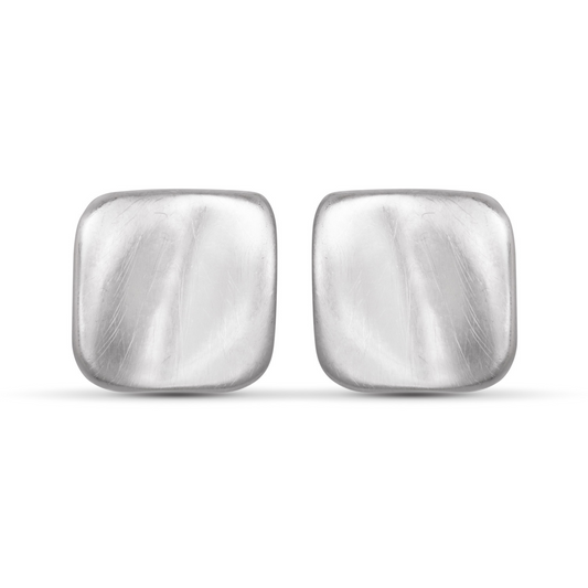 Add a touch of elegance to any outfit with Mia Creased Square Studs. These silver stud earrings feature a sleek matte finish and a unique square design that will elevate your style. Made for everyday wear, these studs are the perfect combination of sophistication and simplicity.